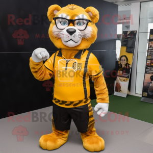 Gold Saber-Toothed Tiger mascot costume character dressed with a Joggers and Reading glasses