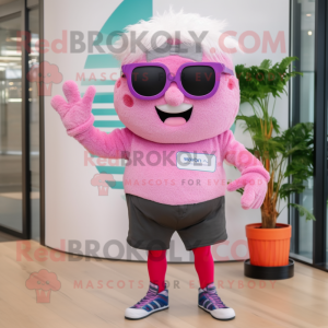 Pink Cupcake mascot costume character dressed with a Bermuda Shorts and Eyeglasses