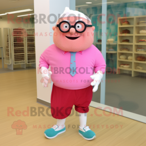 Pink Cupcake mascot costume character dressed with a Bermuda Shorts and Eyeglasses