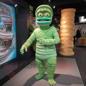 Green Mummy mascot costume character dressed with a Chinos and Wraps