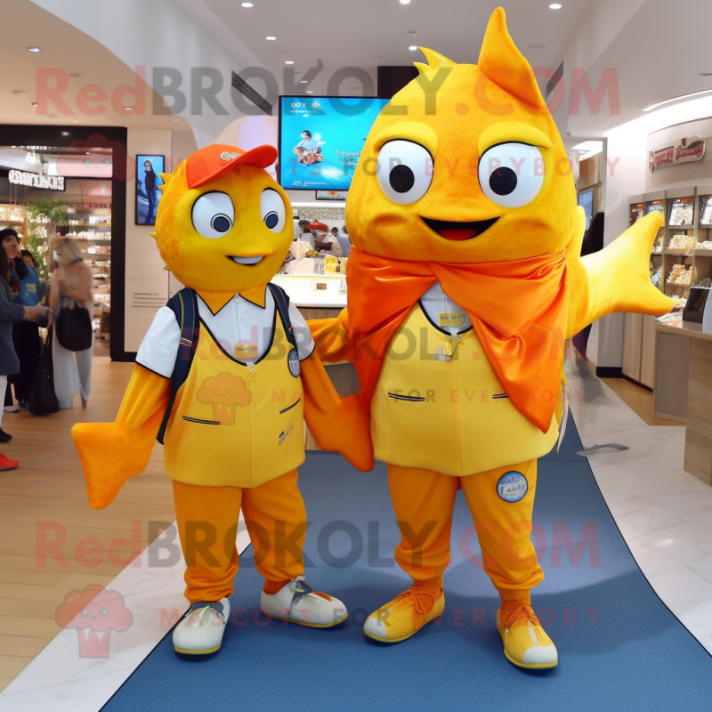 Gold Fish And Chips mascot costume character dressed with a Vest and Messenger bags