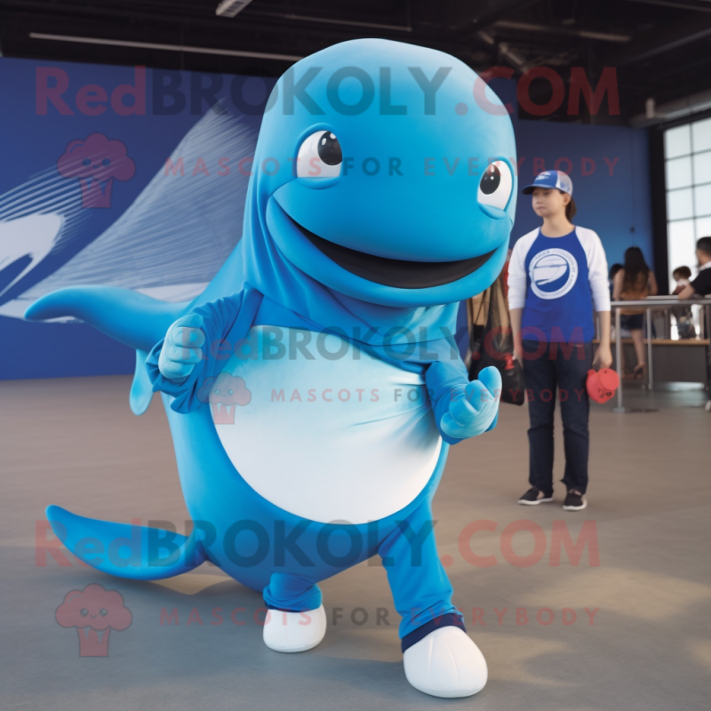 Blue Whale mascot costume character dressed with a Graphic Tee and Rings