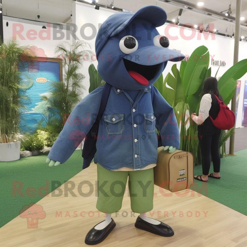 Olive Humpback Whale mascot costume character dressed with a Denim Shorts and Eyeglasses