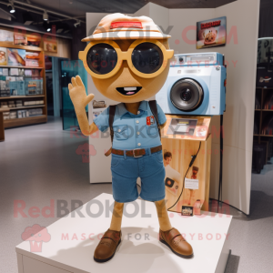 Tan Camera mascot costume character dressed with a Denim Shorts and Keychains