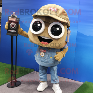 Tan Camera mascot costume character dressed with a Denim Shorts and Keychains