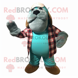 Turquoise Walrus mascot costume character dressed with a Flannel Shirt and Mittens