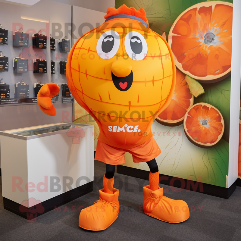 Orange Grenade mascot costume character dressed with a Running Shorts and Tie pins