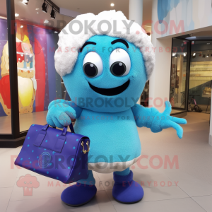 Blue Cupcake mascot costume character dressed with a Sweater and Handbags