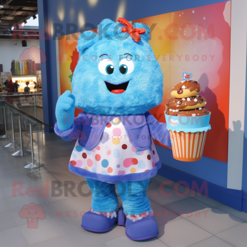 Blue Cupcake mascot costume character dressed with a Sweater and Handbags