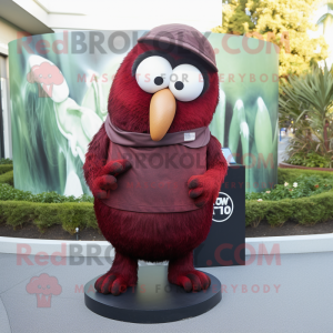 Maroon Kiwi mascot costume character dressed with a Dress Shirt and Rings