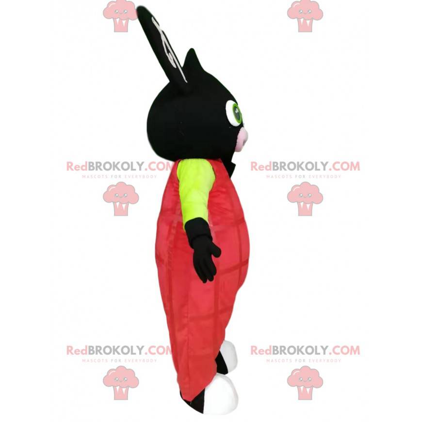 Schwarzes Kaninchenmaskottchen mit rosa Overalls -