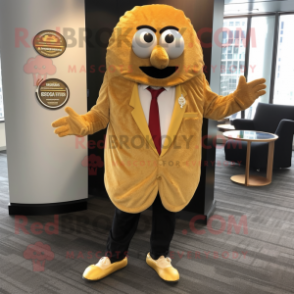 Gold Falafel mascot costume character dressed with a Blazer and Shoe clips