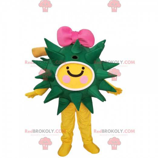 Green and yellow virus mascot with a pink bow tie -