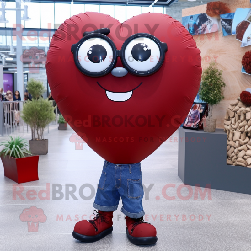 Maroon Heart Shaped Balloons mascot costume character dressed with a Boyfriend Jeans and Eyeglasses