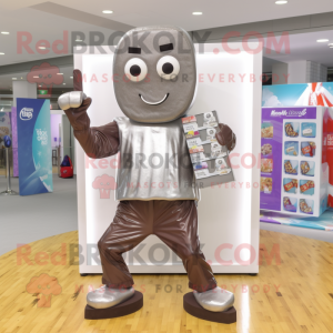 Silver Chocolate Bar mascot costume character dressed with a Board Shorts and Scarves