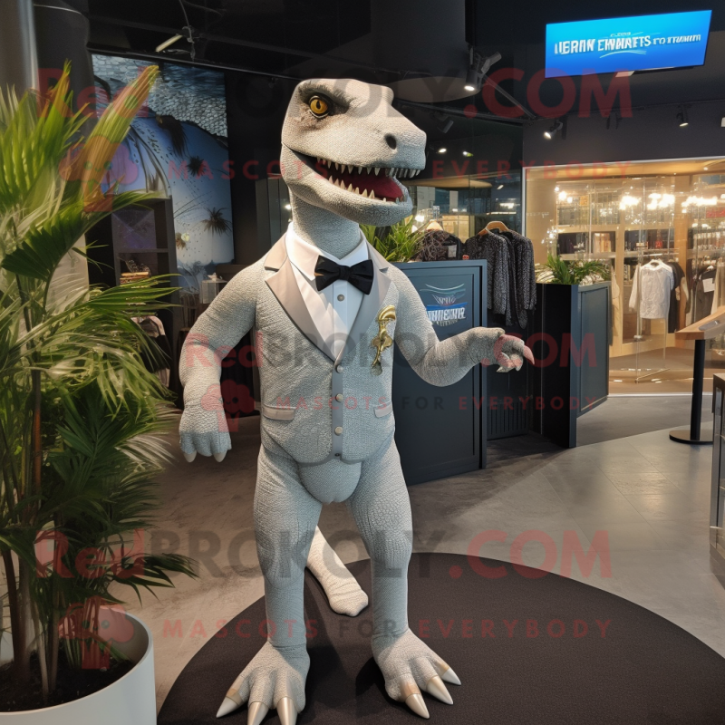 Silver Tyrannosaurus mascot costume character dressed with a Swimwear and Cufflinks