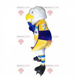 Mascota águila real blanca en ropa deportiva azul y amarilla -