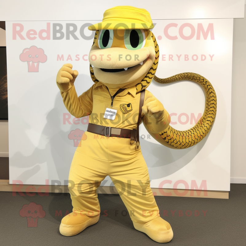 Gold Snake mascot costume character dressed with a Dungarees and Belts Gold Snake mascot costume character dressed with a Dungarees and Belts