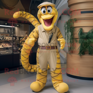 Gold Snake mascot costume character dressed with a Dungarees and Belts