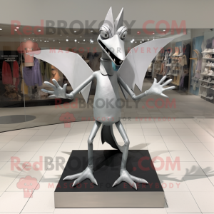 Silver Pterodactyl mascot costume character dressed with a Graphic Tee and Shoe clips