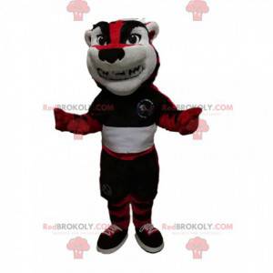 Mascotte de tigre rouge et noir avec une tenue de sport -