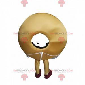 Donut Maskottchen mit schönem Lächeln und einer Schürze -