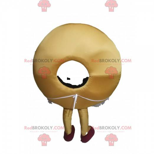 Mascota de donut con hermosa sonrisa y un delantal. -