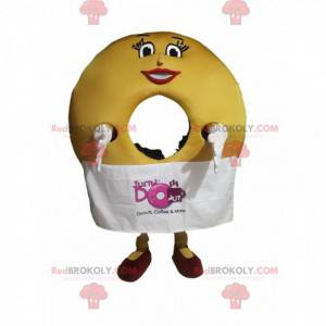 Donut Maskottchen mit schönem Lächeln und einer Schürze -