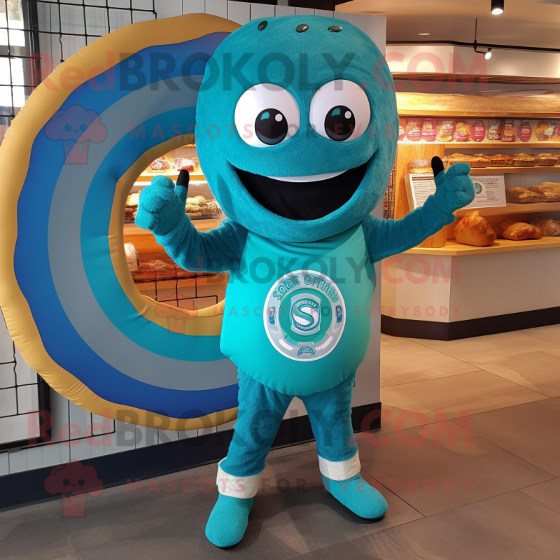 Teal Bagels mascot costume character dressed with a Playsuit and Rings Teal Bagels mascot costume character dressed with a Playsuit and Rings