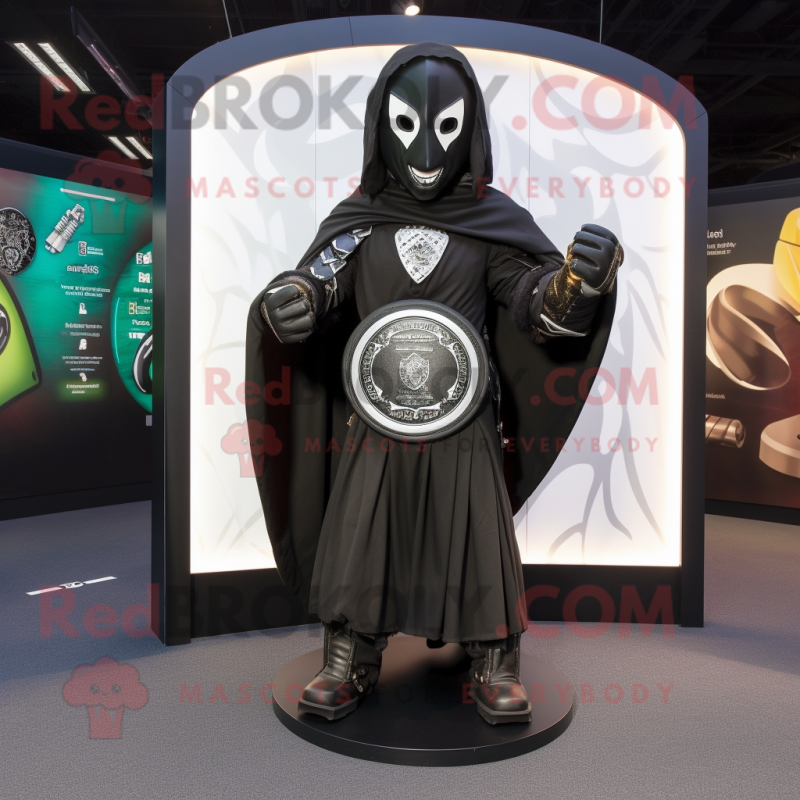 Black Celtic Shield mascot costume character dressed with a Cover-up and Clutch bags Black Celtic Shield mascot costume character dressed with a Cover-up and Clutch bags