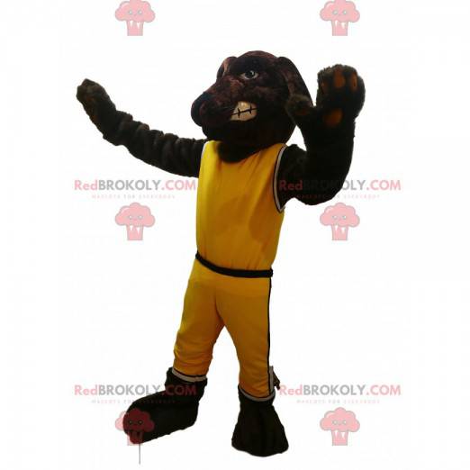 Mascotte de chien marron avec une tenue de sport jaune -