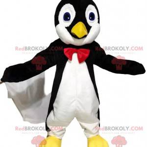 Mascotte del pinguino in bianco e nero con un farfallino rosso