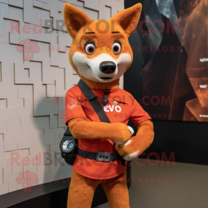 Rust Dingo mascot costume character dressed with a Graphic Tee and Smartwatches