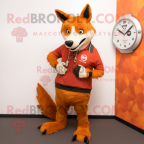 Rust Dingo mascot costume character dressed with a Graphic Tee and Smartwatches