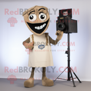 Tan Camera mascot costume character dressed with a V-Neck Tee and Shoe clips