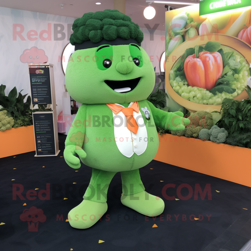Peach Broccoli mascot costume character dressed with a Suit Jacket and Keychains Peach Broccoli mascot costume character dressed with a Suit Jacket and Keychains