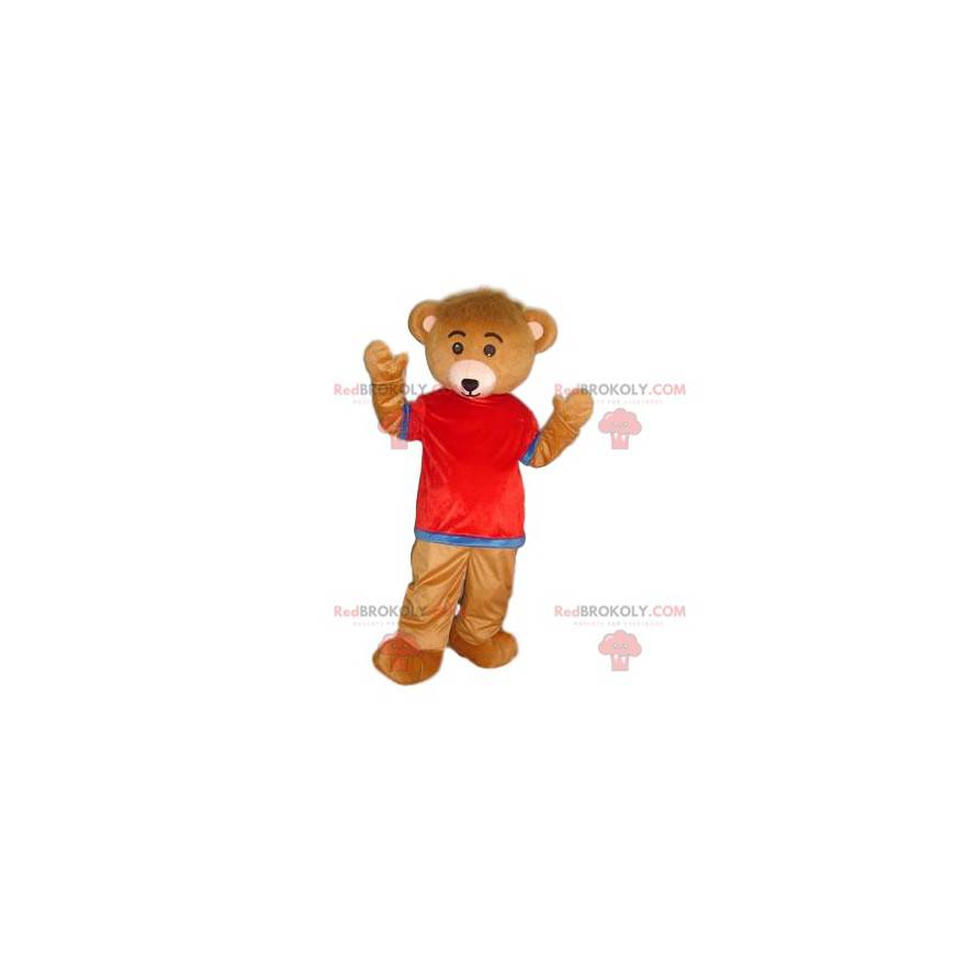 Mascotte orso bruno molto carino con una maglia rossa e blu -