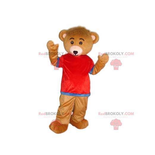Mascote urso marrom muito fofo com uma camisa vermelha e azul -