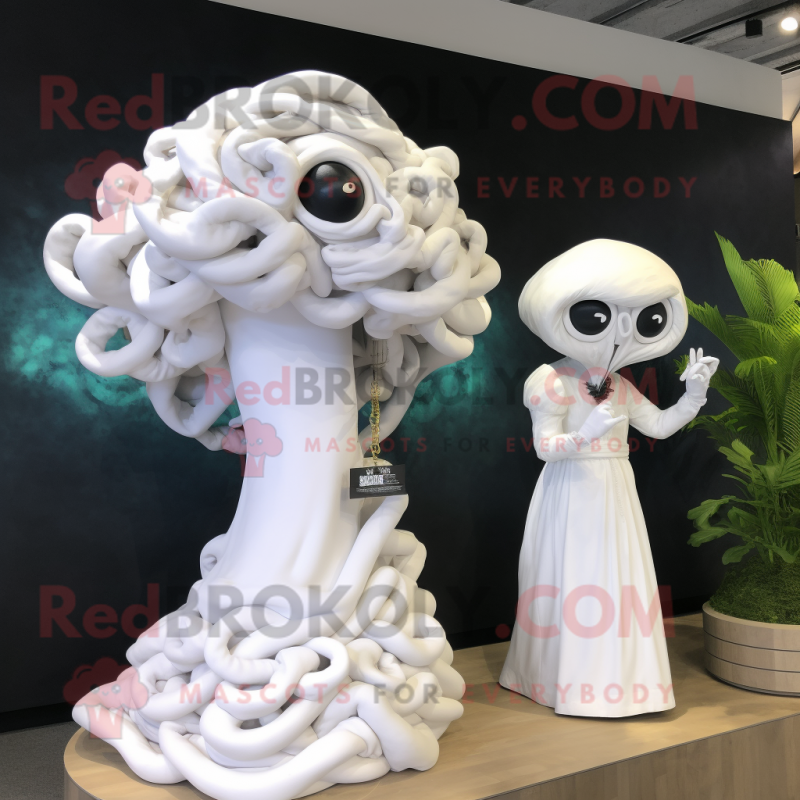 White Medusa mascot costume character dressed with a Wedding Dress and Cufflinks White Medusa mascot costume character dressed with a Wedding Dress and Cufflinks