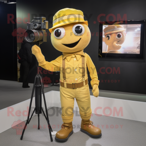 Gold Camera mascot costume character dressed with a Overalls and Hat pins