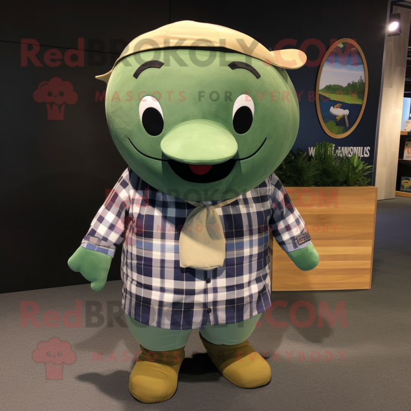 Olive Whale mascot costume character dressed with a Flannel Shirt and Keychains