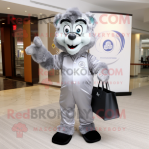 Silver Alliance mascot costume character dressed with a Suit Pants and Tote bags
