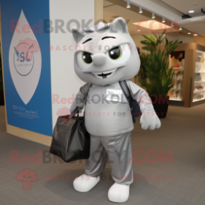 Silver Alliance mascot costume character dressed with a Suit Pants and Tote bags