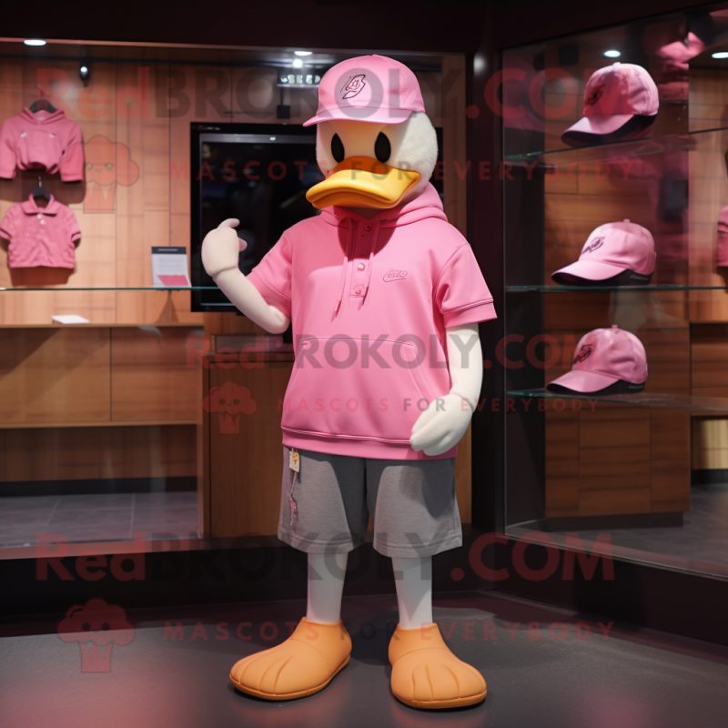 Pink Duck mascot costume character dressed with a Sweatshirt and Hats