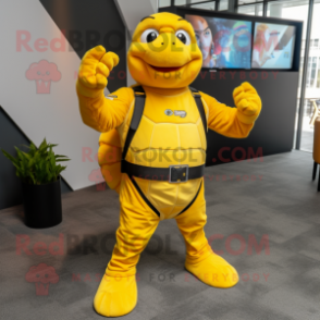 Yellow Turtle mascot costume character dressed with a Rash Guard and Suspenders