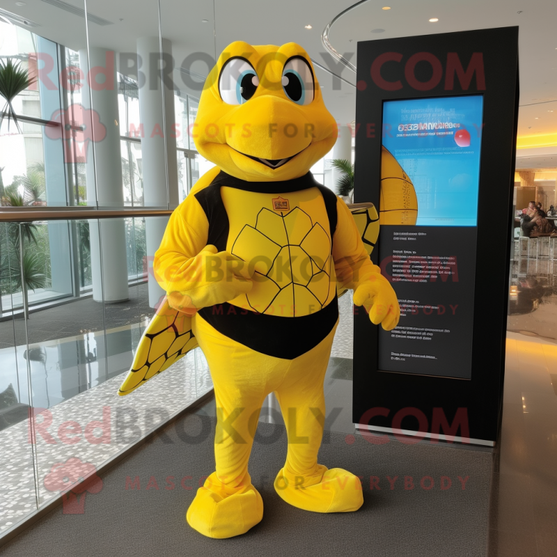 Yellow Turtle mascot costume character dressed with a Rash Guard and Suspenders