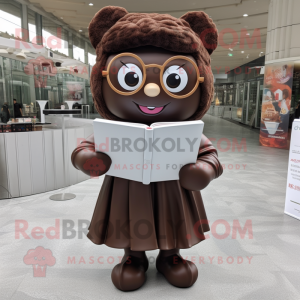 Brown Candy mascot costume character dressed with a A-Line Skirt and Reading glasses