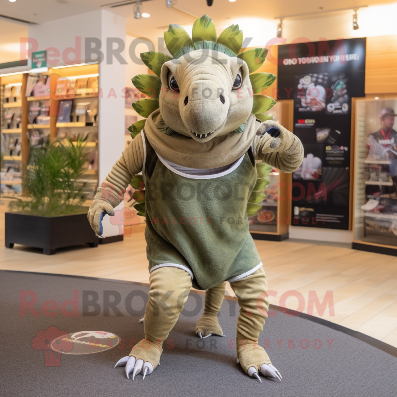 Olive Armadillo mascot costume character dressed with a Running Shorts and Tie pins