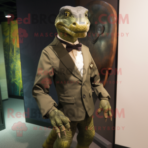 Olive Komodo Dragon mascot costume character dressed with a Suit Jacket and Brooches