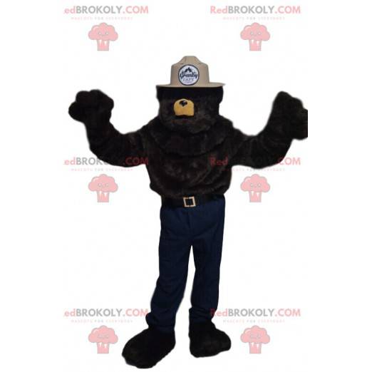Mascotte d'ours brun avec un chapeau beige de sheriff -
